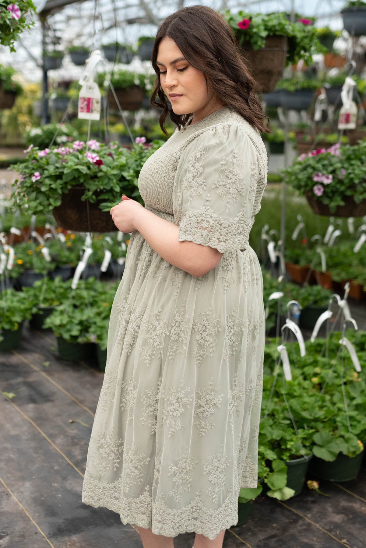 Side view of the plus size sage embroidered dress