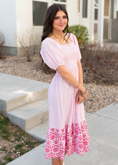 Side view of the pink stripe eyelet dress