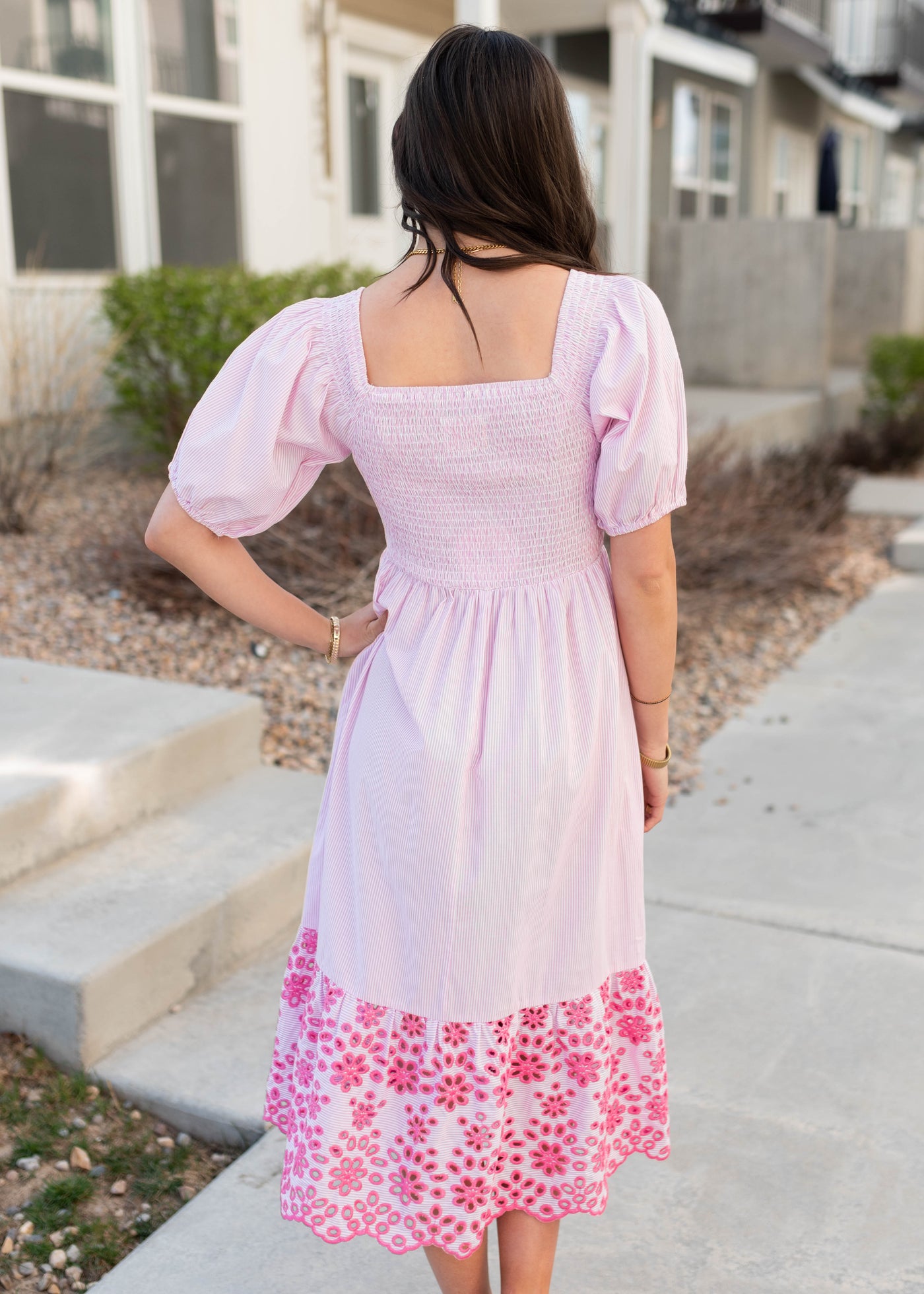 Back view of the pink stripe eyelet dress