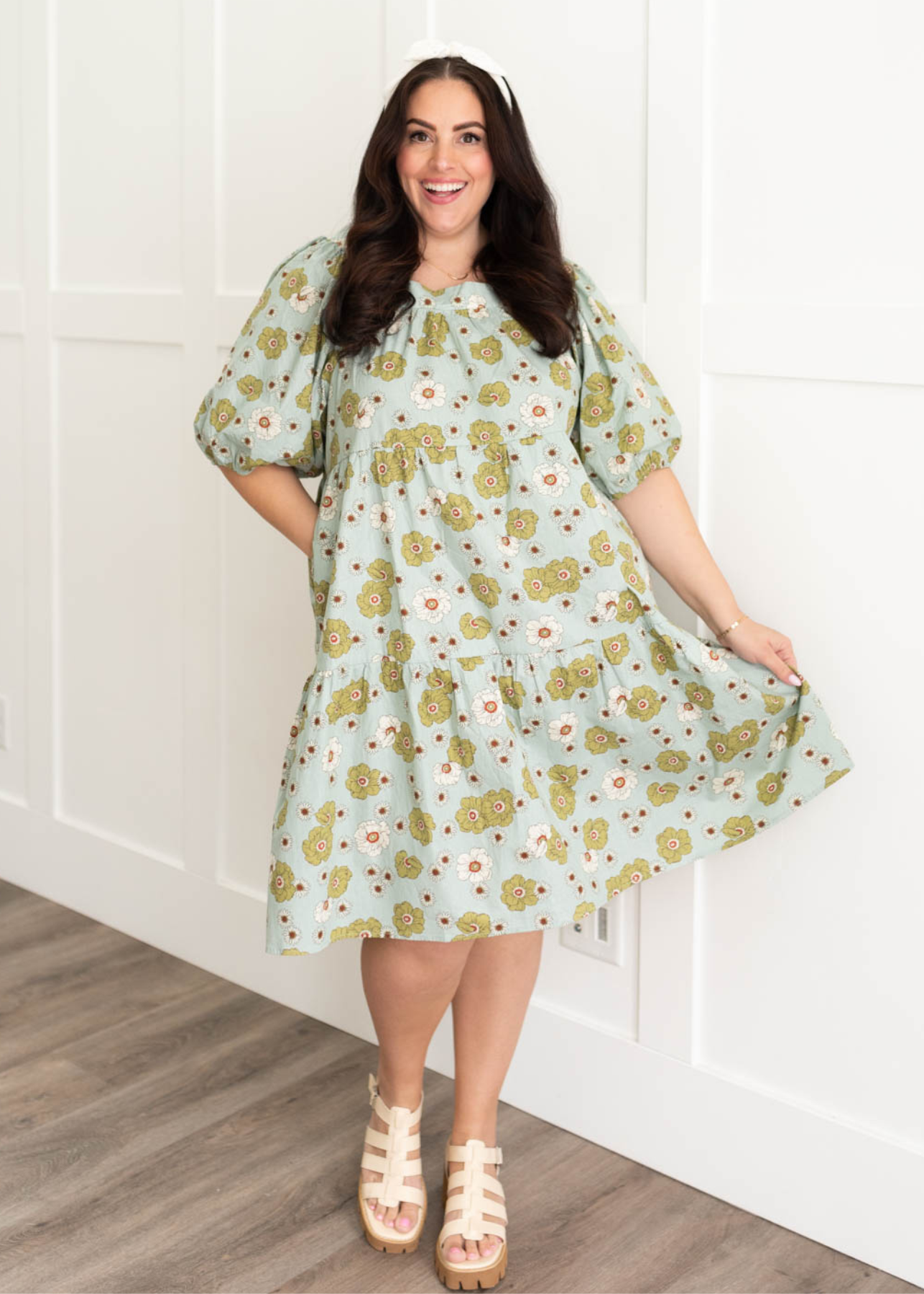 Plus size sage floral dress with a tiered skirt