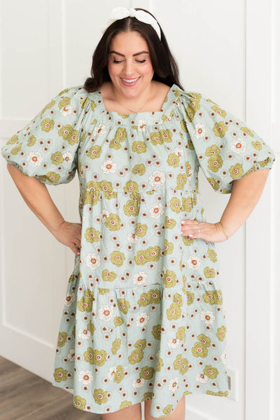Front view of the plus size sage floral dress