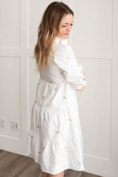 Side view of the ivory embroidered button down dress