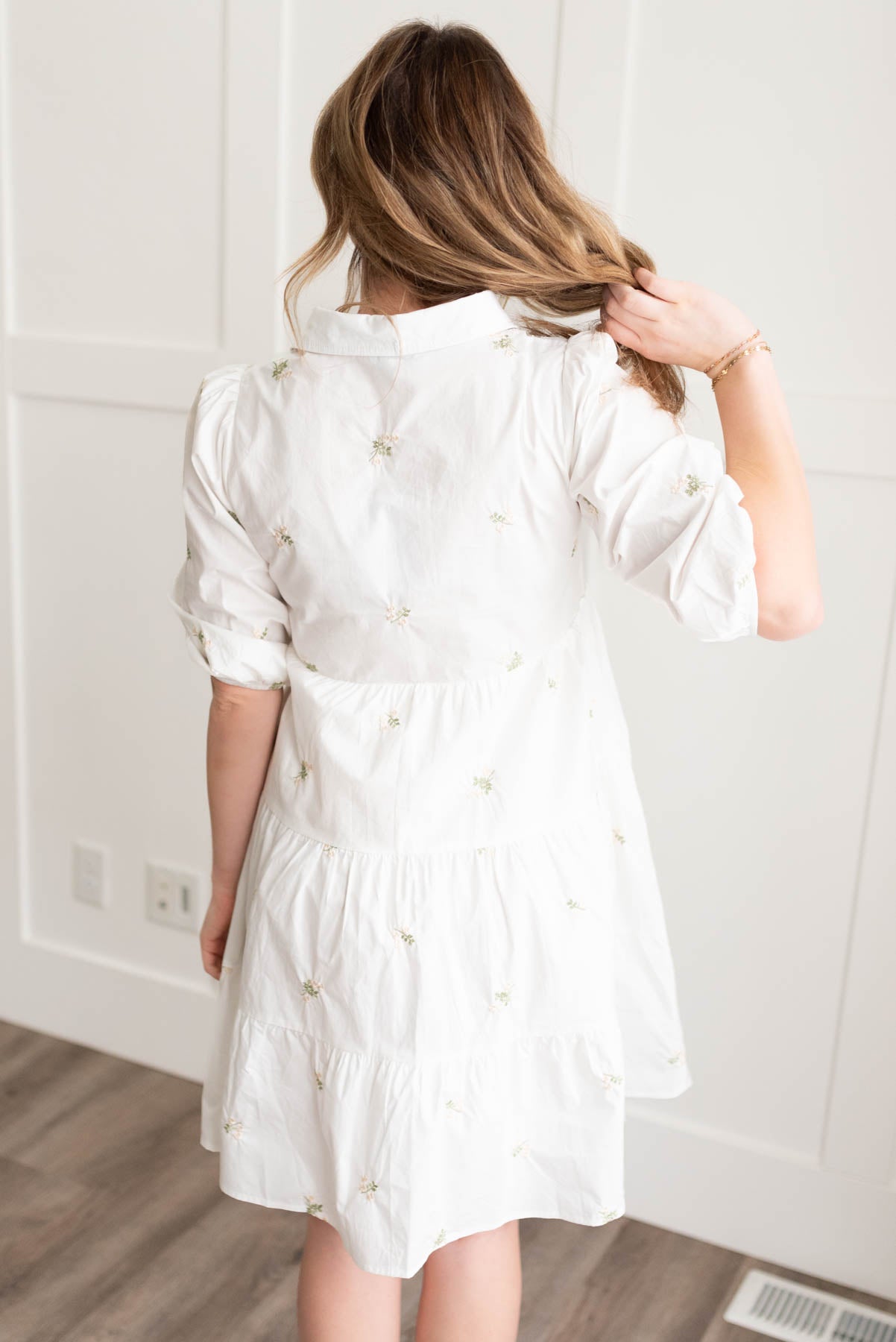 Back view of the ivory embroidered button down dress