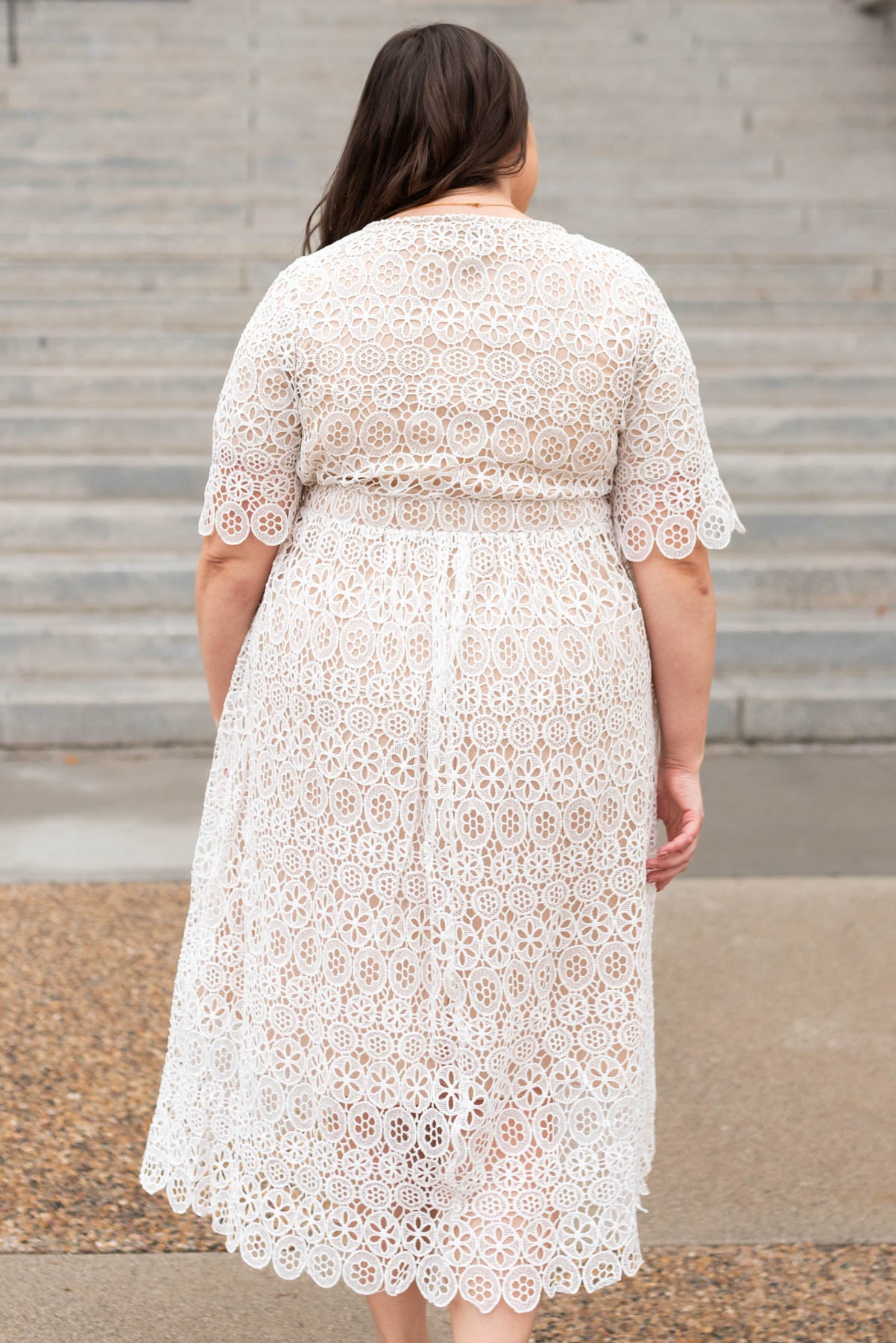 Back view of a plus ivory lace dress