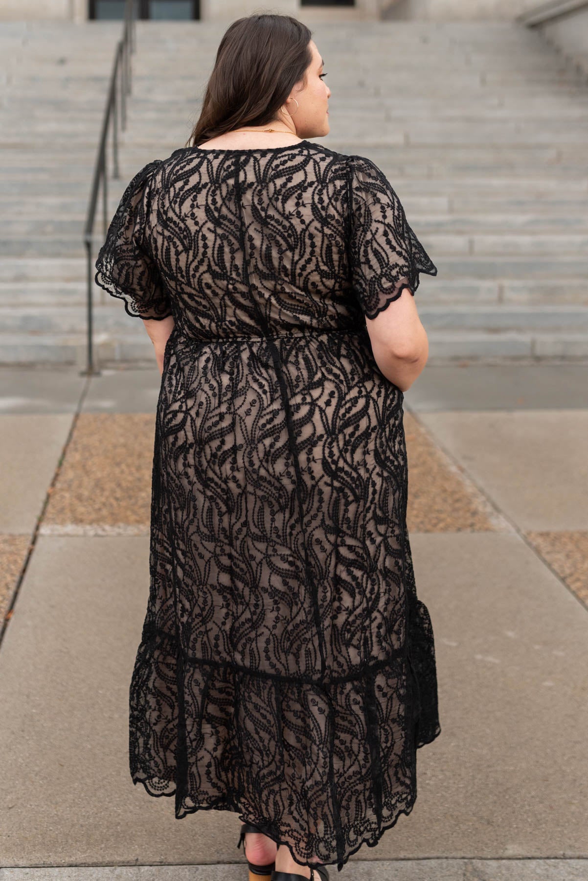 Back view of a plus lace black dress 