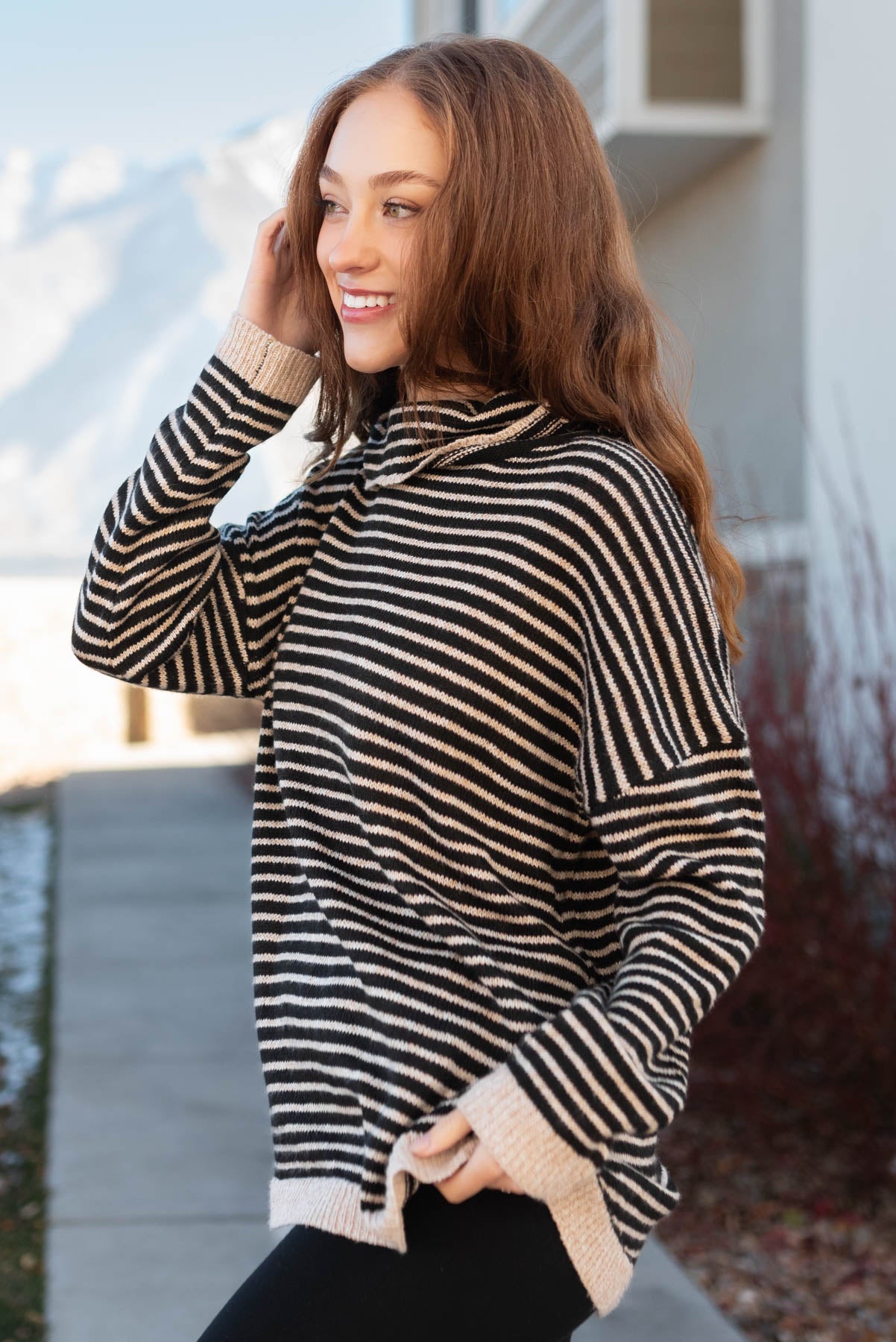 Side view of a turtle neck sweater