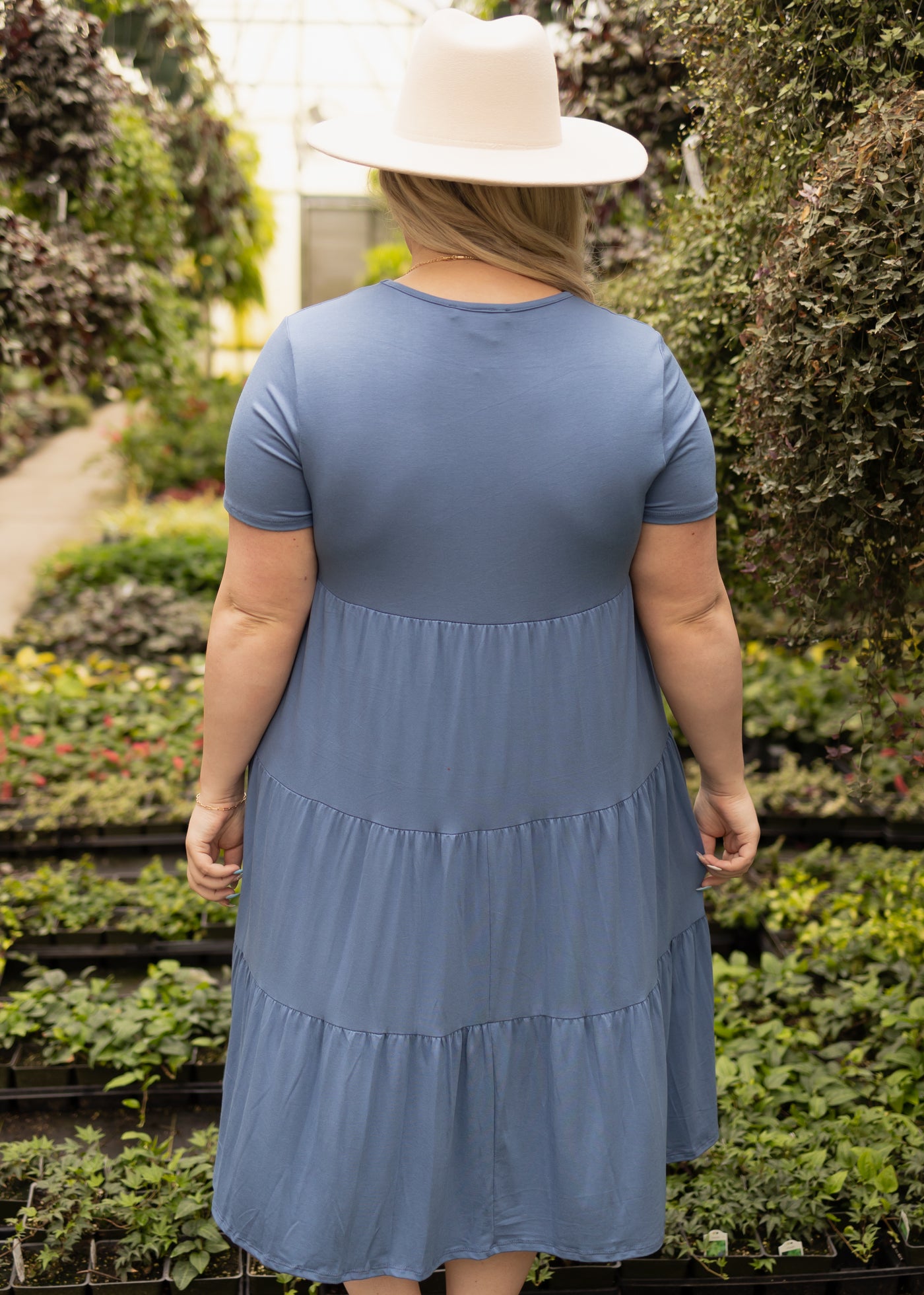 Back view of a plus size denim blue dress