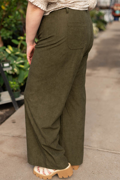 Side view of the plus size olive corduroy pants