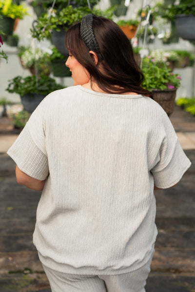 Back view of the plus size sage grey textured top