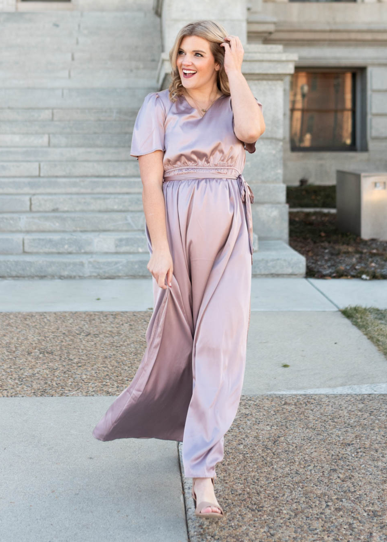 Front view of a long lavender dress with short sleeves