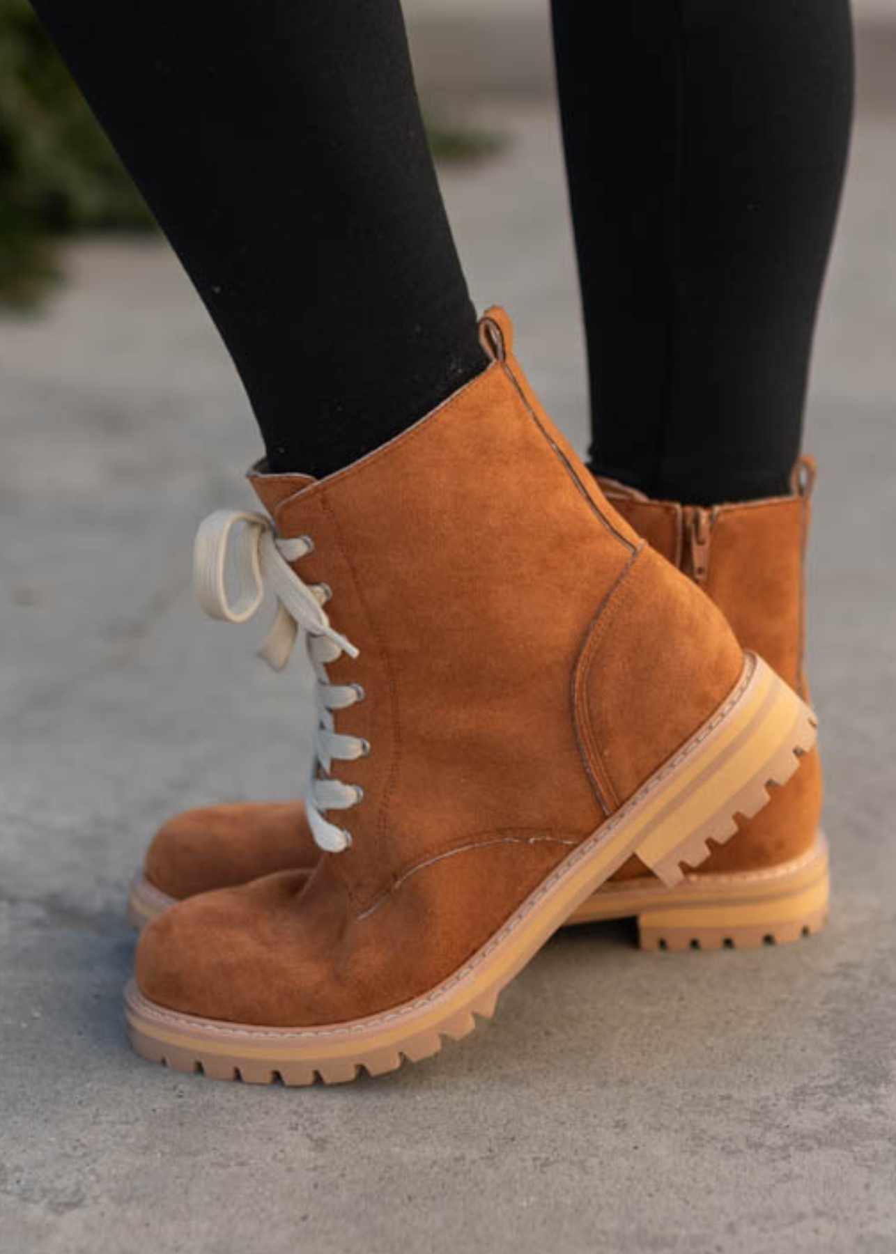 Side view of camel lace up boots
