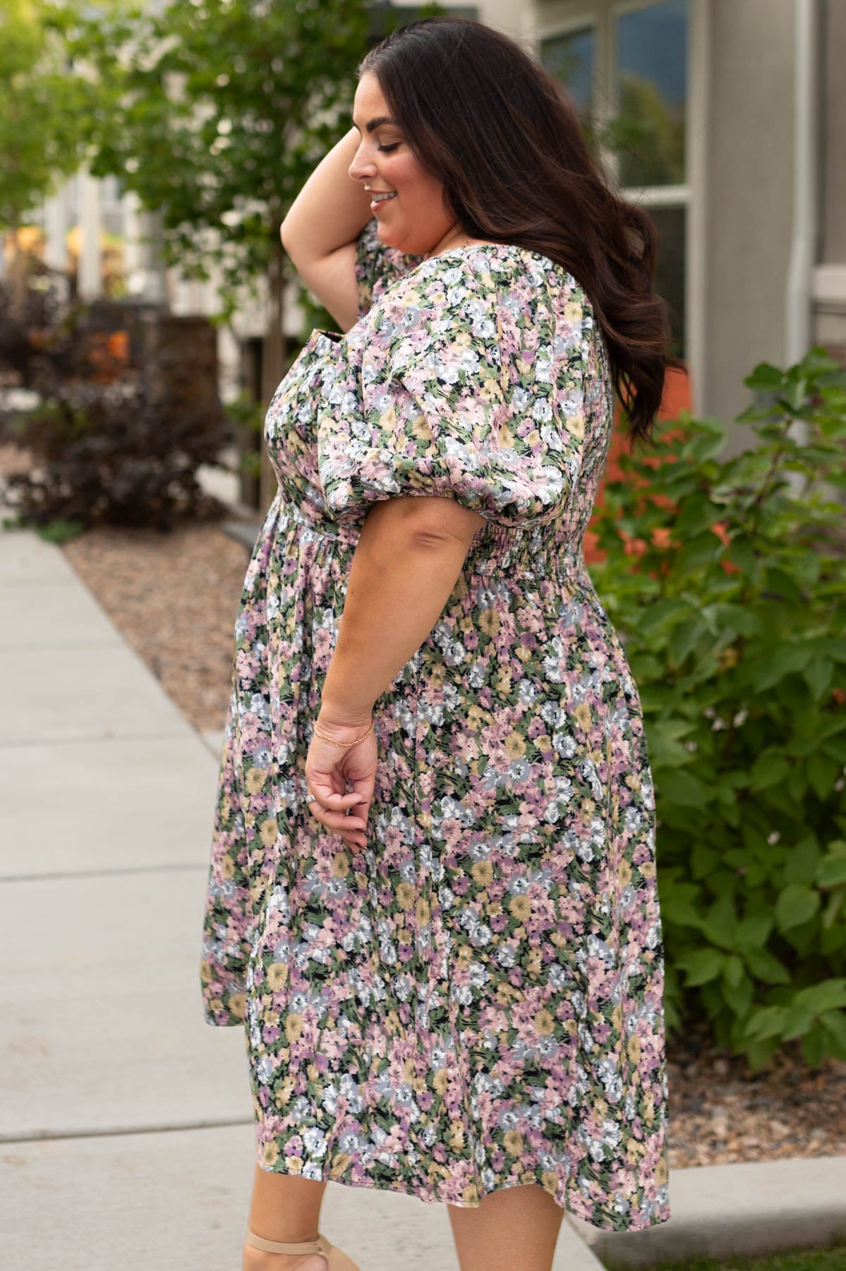 Side view of a plus size floral dress