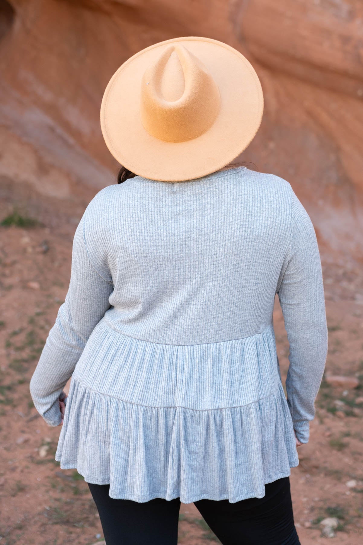 Back view of a plus size heather grey top