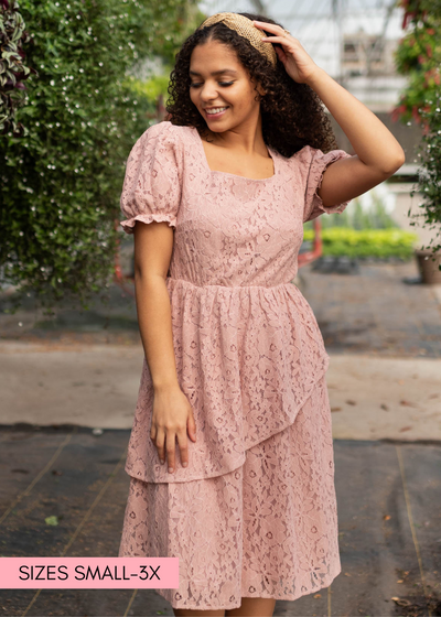 Dusty pink lace tiered dress with short sleeves and square neck.