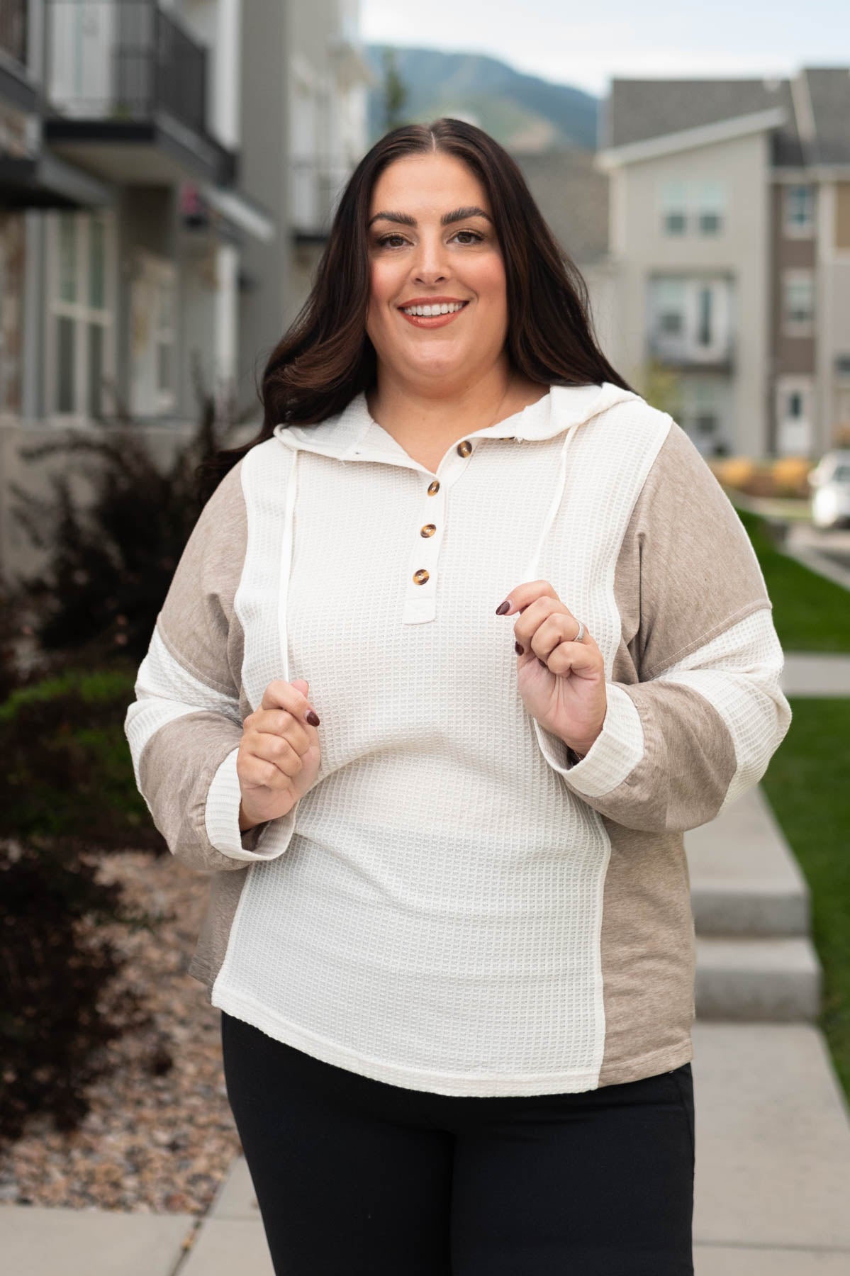 Tan color blocks on a plus size cream textured hoodie