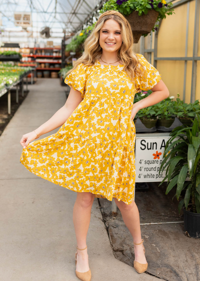 Short sleeve mustard floral dress with tiered skirt