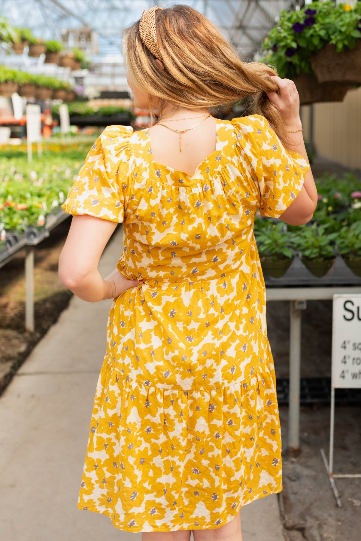 Back view of the mustard floral dress