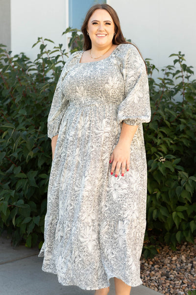 Plus size floral dress with smocked bodice and 3/4 sleeves