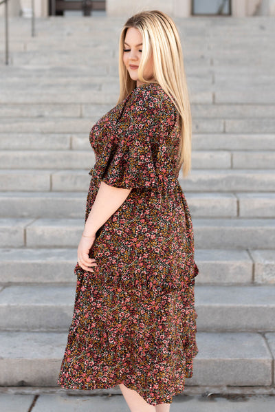 Side view of a floral tiered ruffle dress