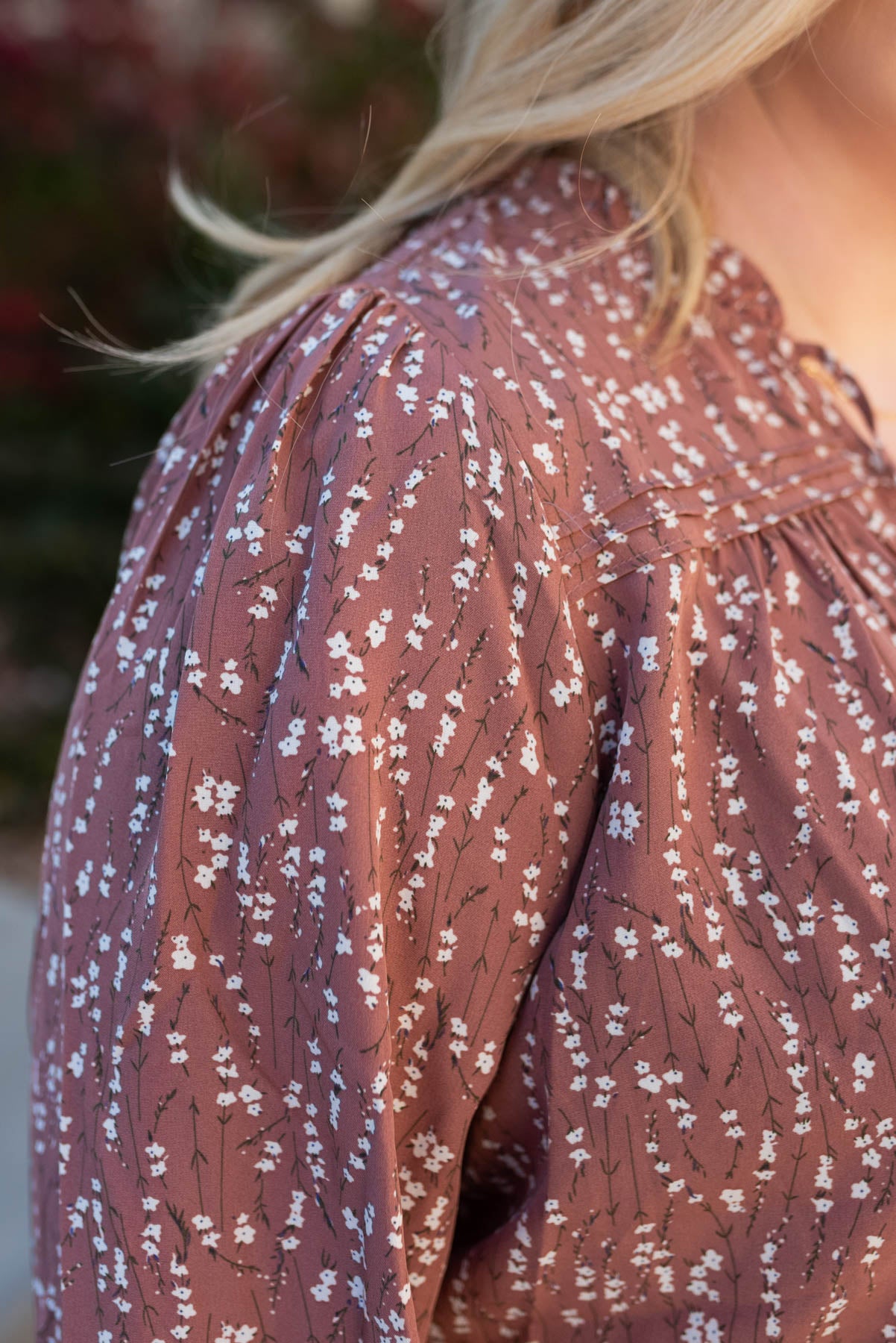 Close up of the floral pattern on the plus size marsala floral blouse