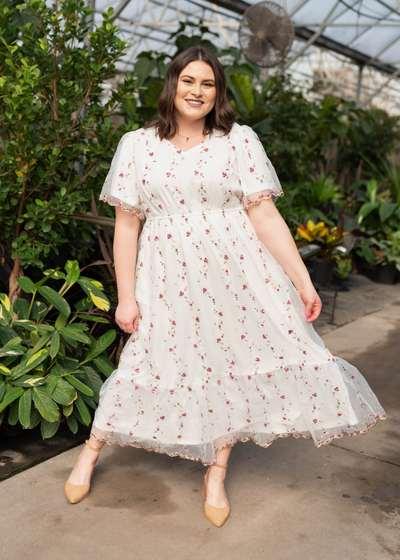 Plus size ivory embroidered floral dress with short sleeves and ruffle at the hem