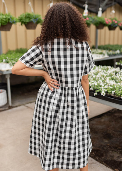 Back view of the black gingham button dress