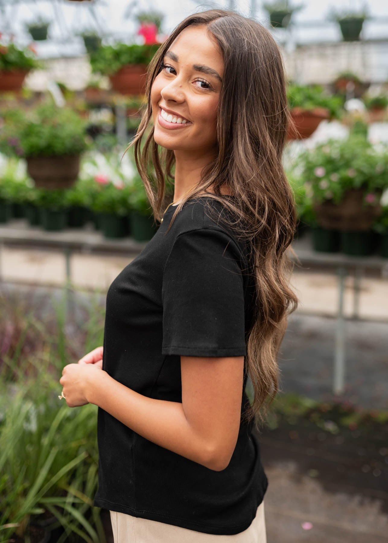 Side view of the black ribbed top