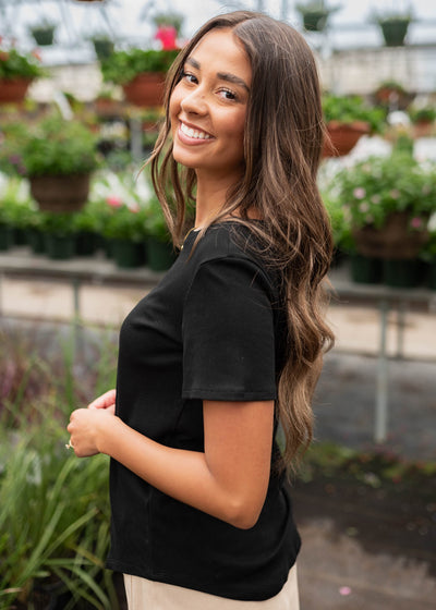 Side view of the black ribbed top
