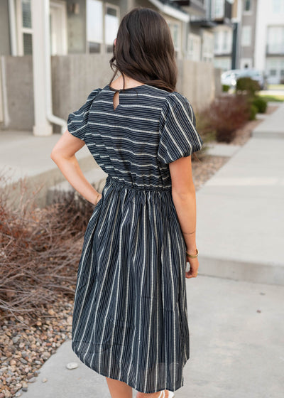 Back view of the navy jacquard stripe dress