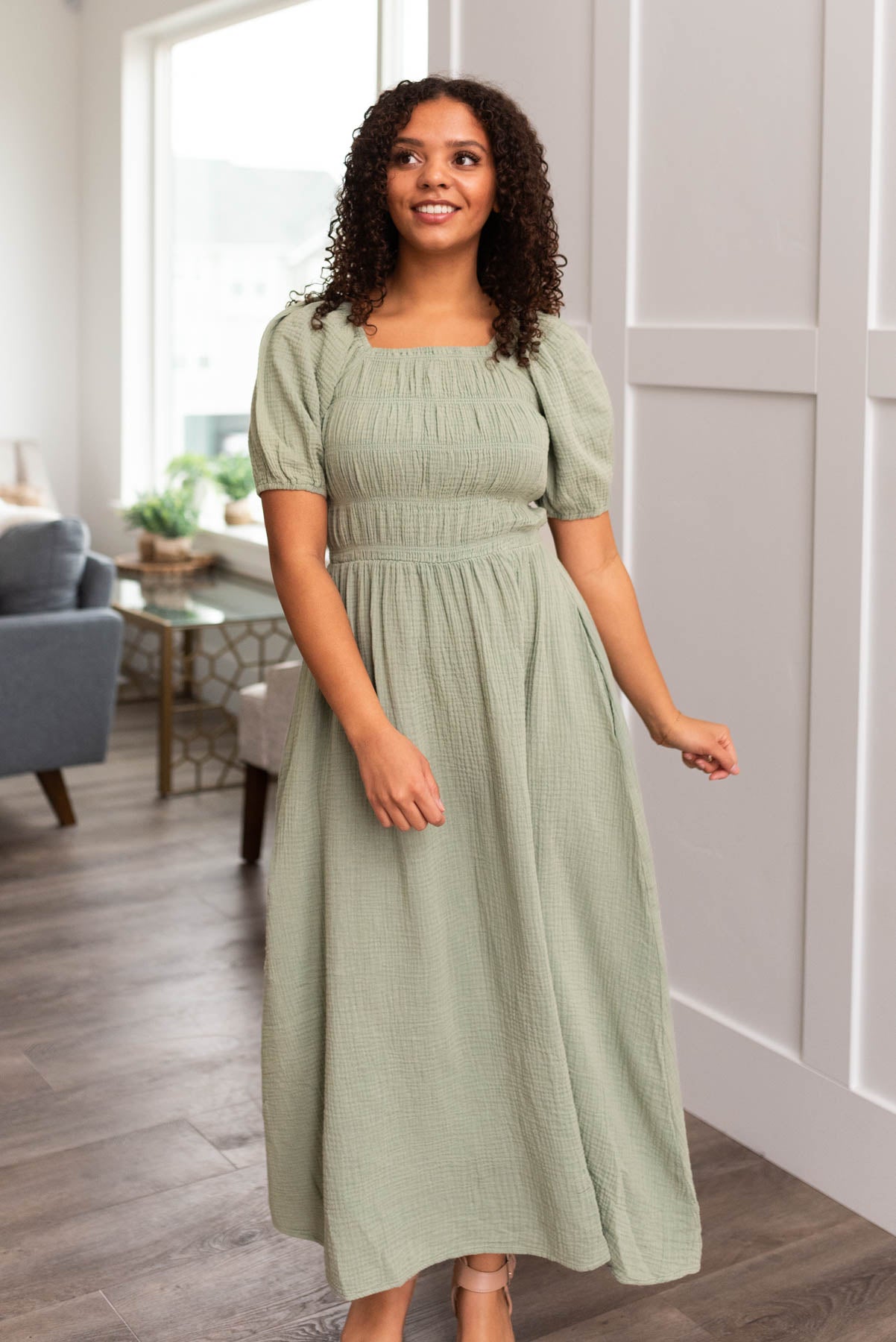 Sage smocked dress with tiered smocking on the bodice