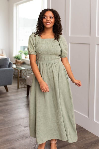 Sage smocked dress with tiered smocking on the bodice