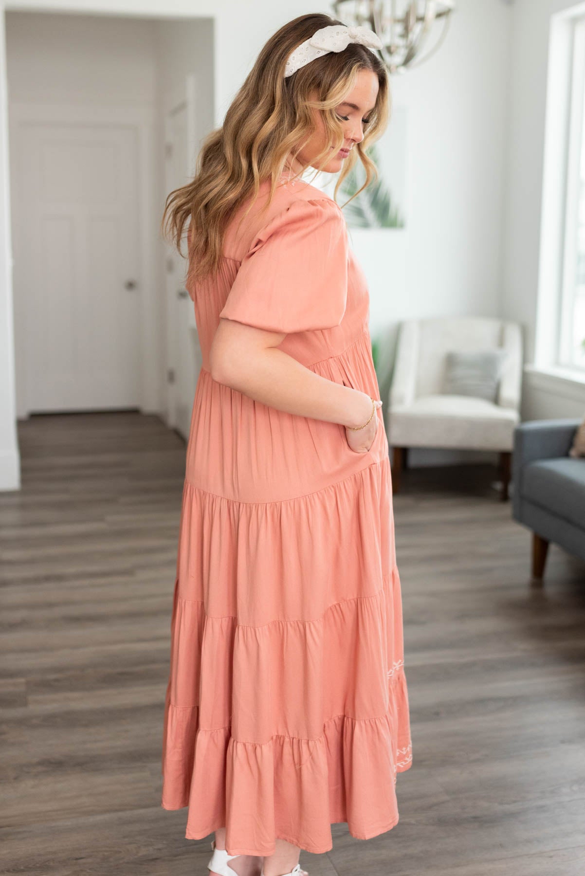 Side view of the dusty pink embroidered tiered dress