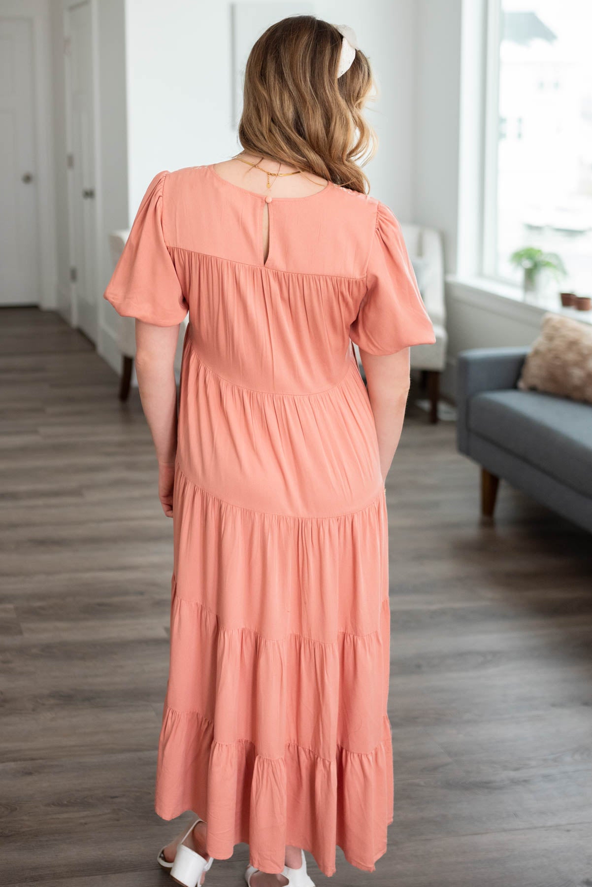Back view of the dusty pink embroidered tiered dress