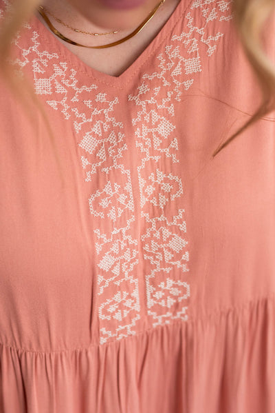 Close up of the embroidery on the dusty pink embroidered tiered dress