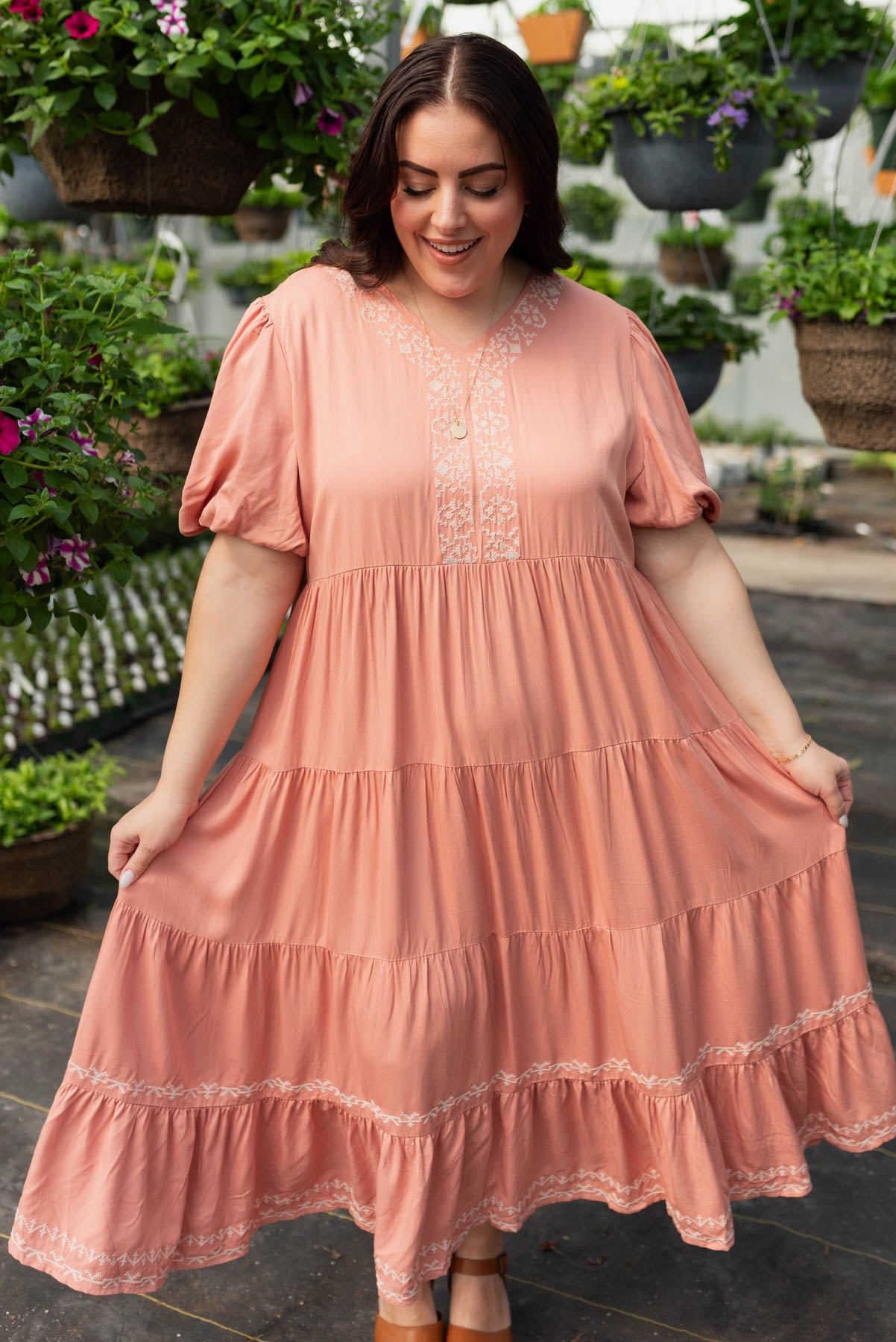 Plus size dusty pink embroidered tiered dress with embroidery around the neck and down the front