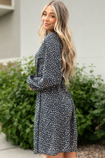 Side view of a long sleeve black leopard dress