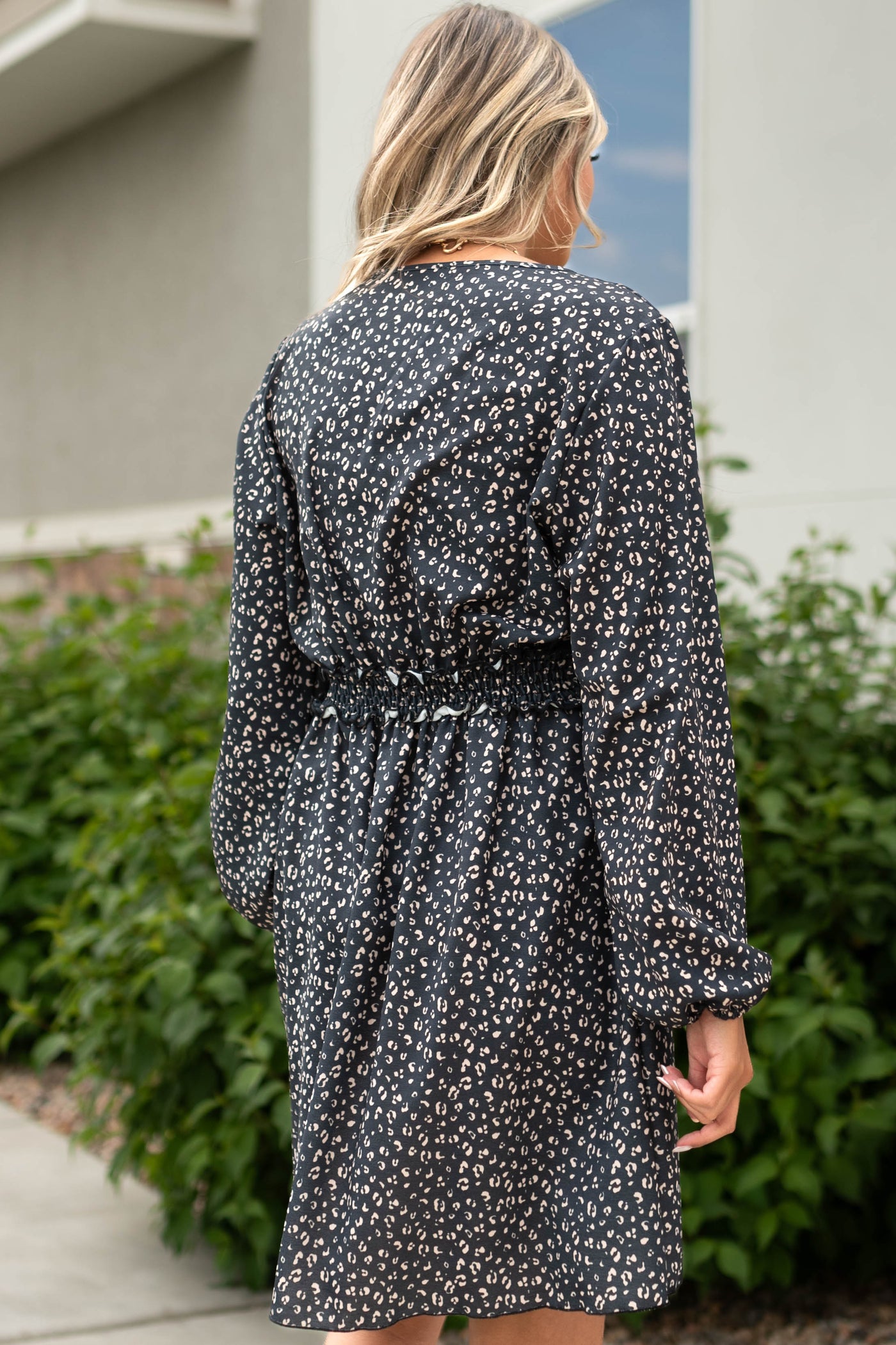 Back view of a black leopard dress