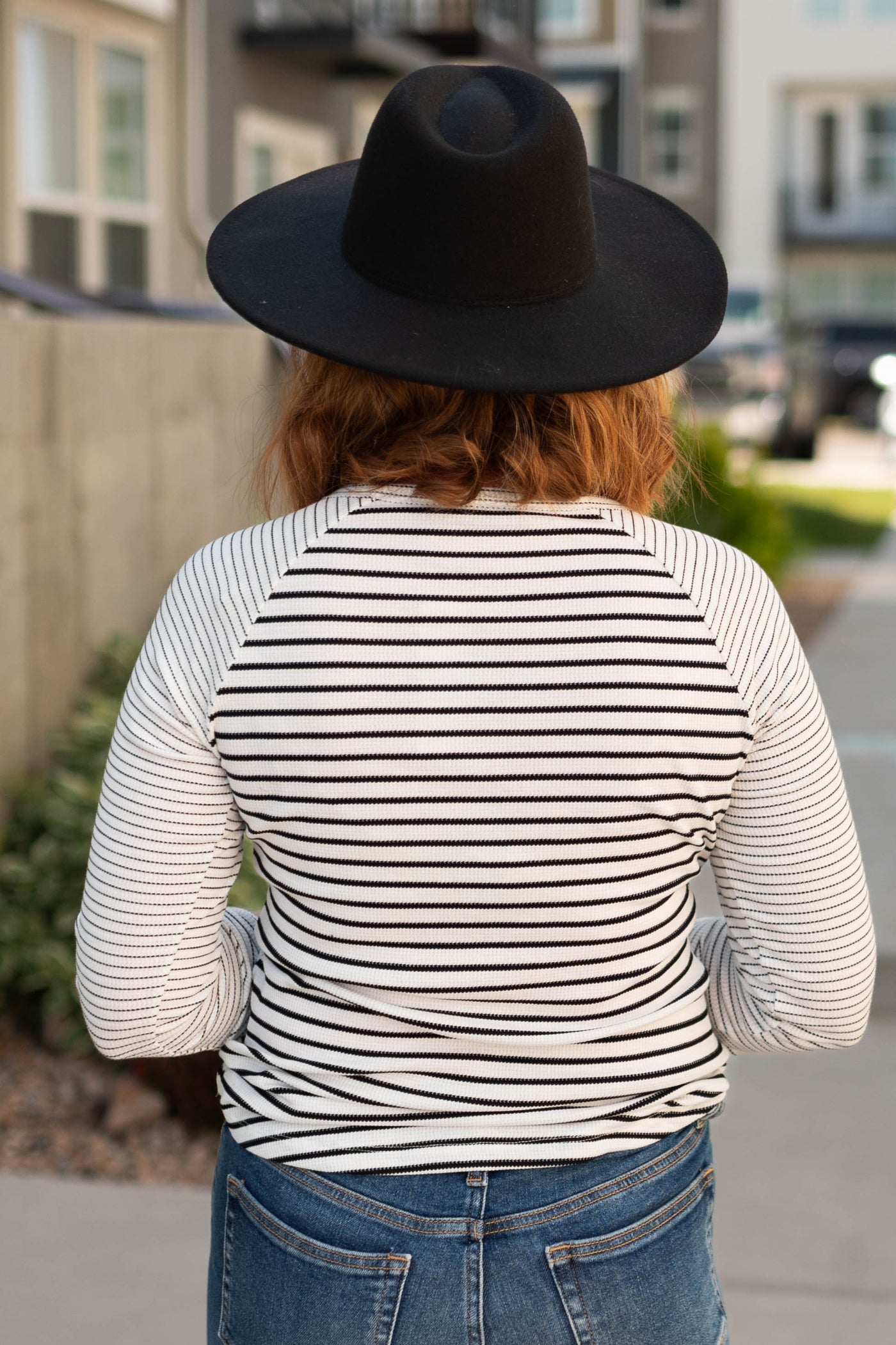 Back view of a white stripe top