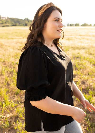 Side view of a plus size black top