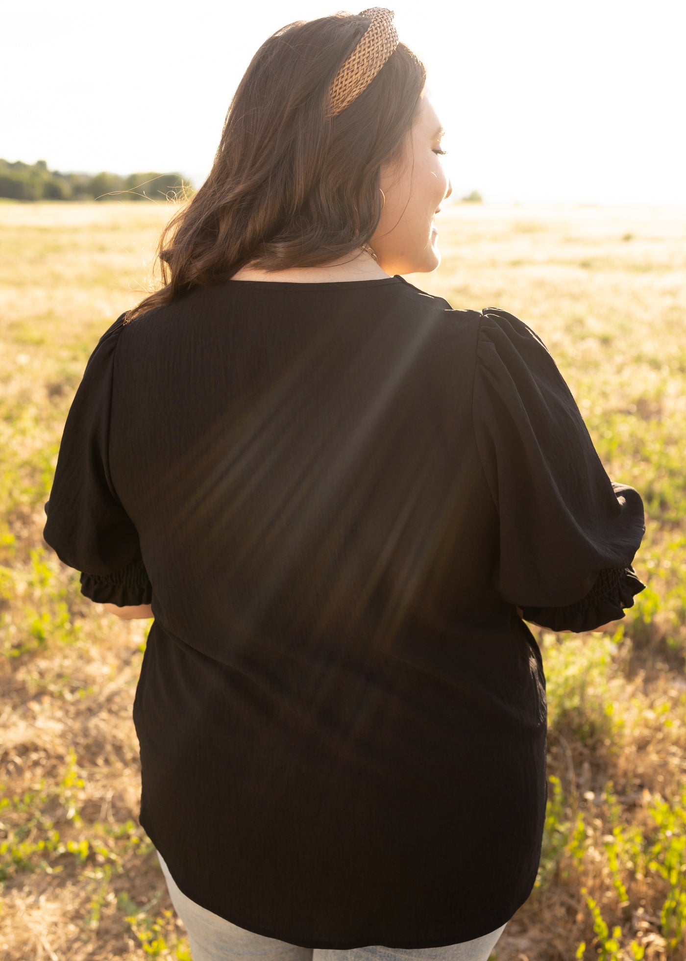 Back view of a plus size black top