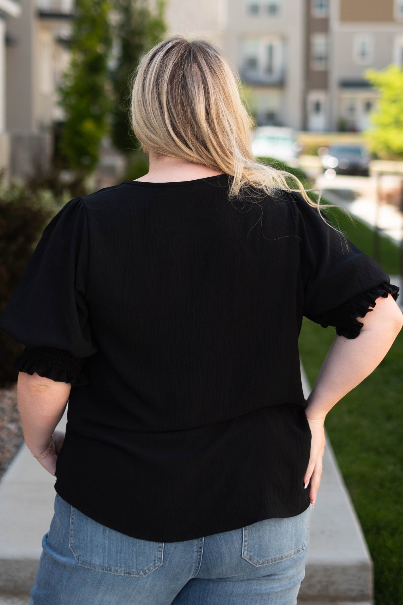 Back view of a plus size black top