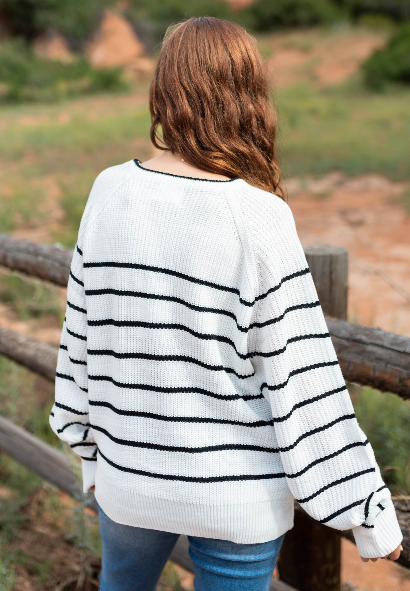 Back view of a ivory sweater