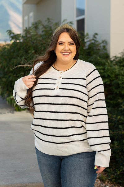 Plus size ivory sweater with black stripes