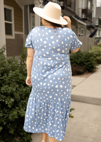 Back view of a plus size blue dress