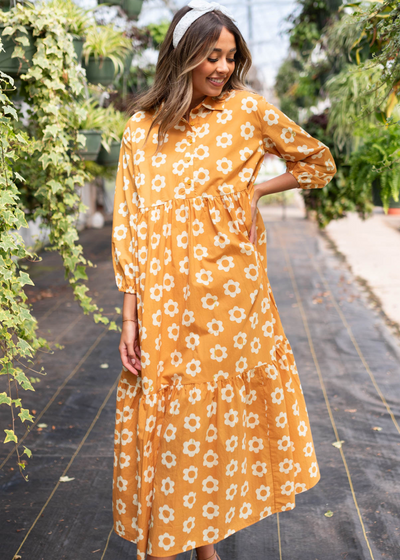 Golden floral dress with tiered skirt