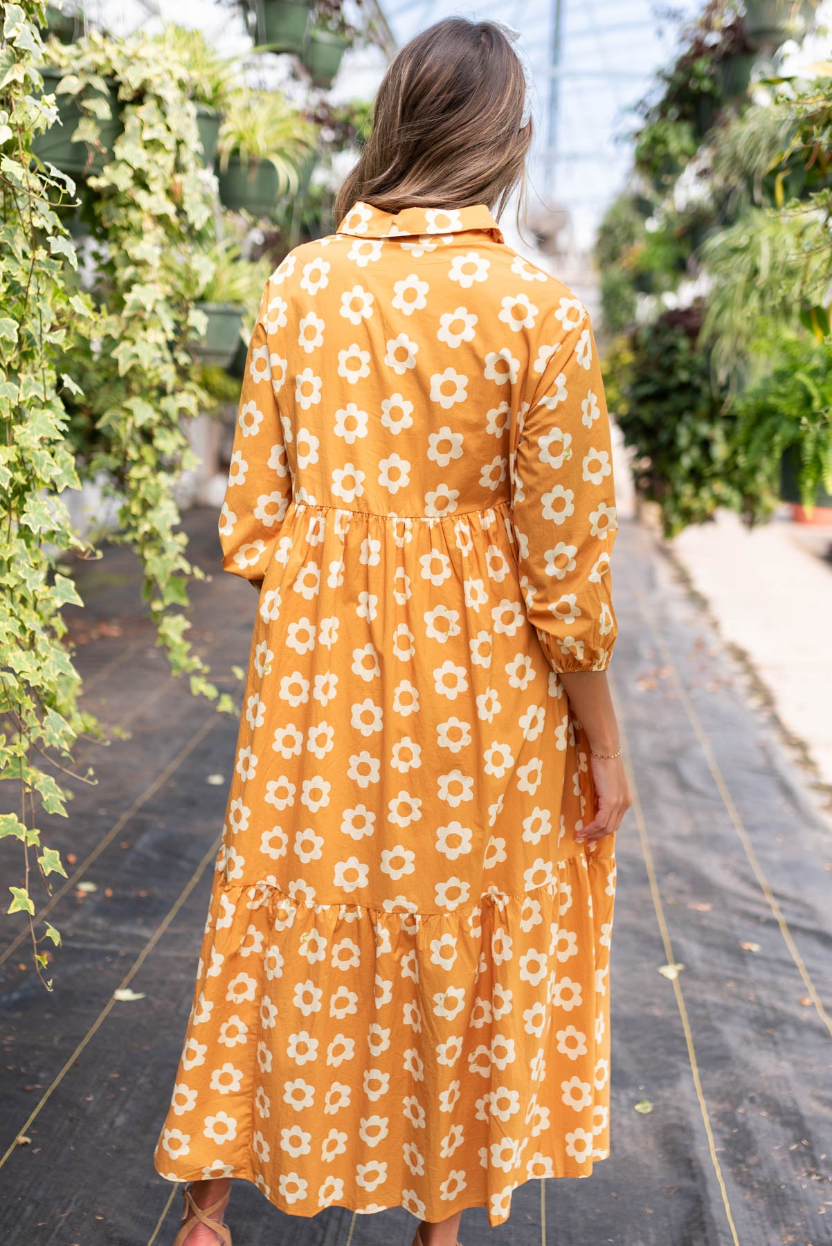 Back view of the golden floral dress