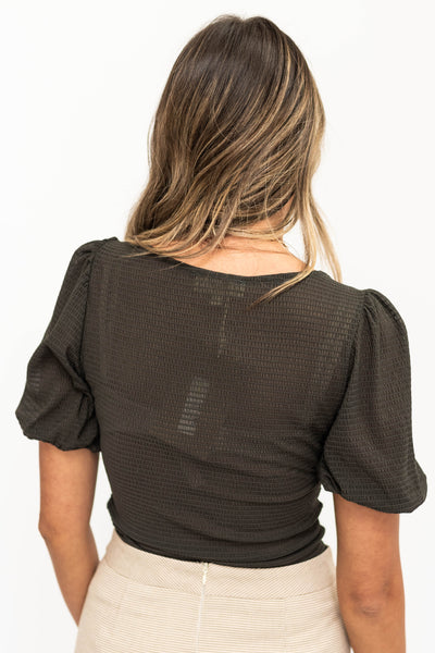 Charcoal top with full sleeves and square neckline.