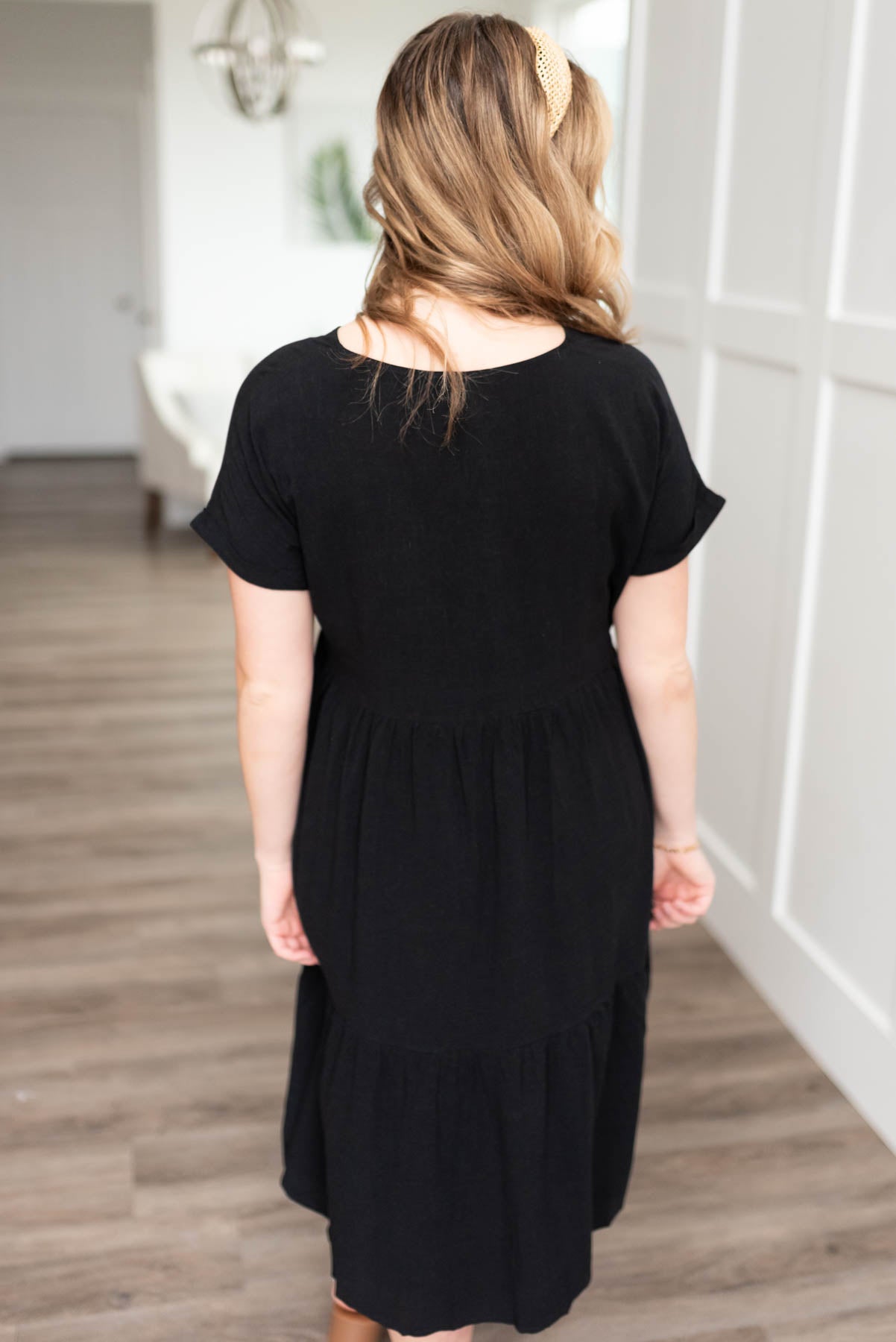 Back view of a black tiered dress