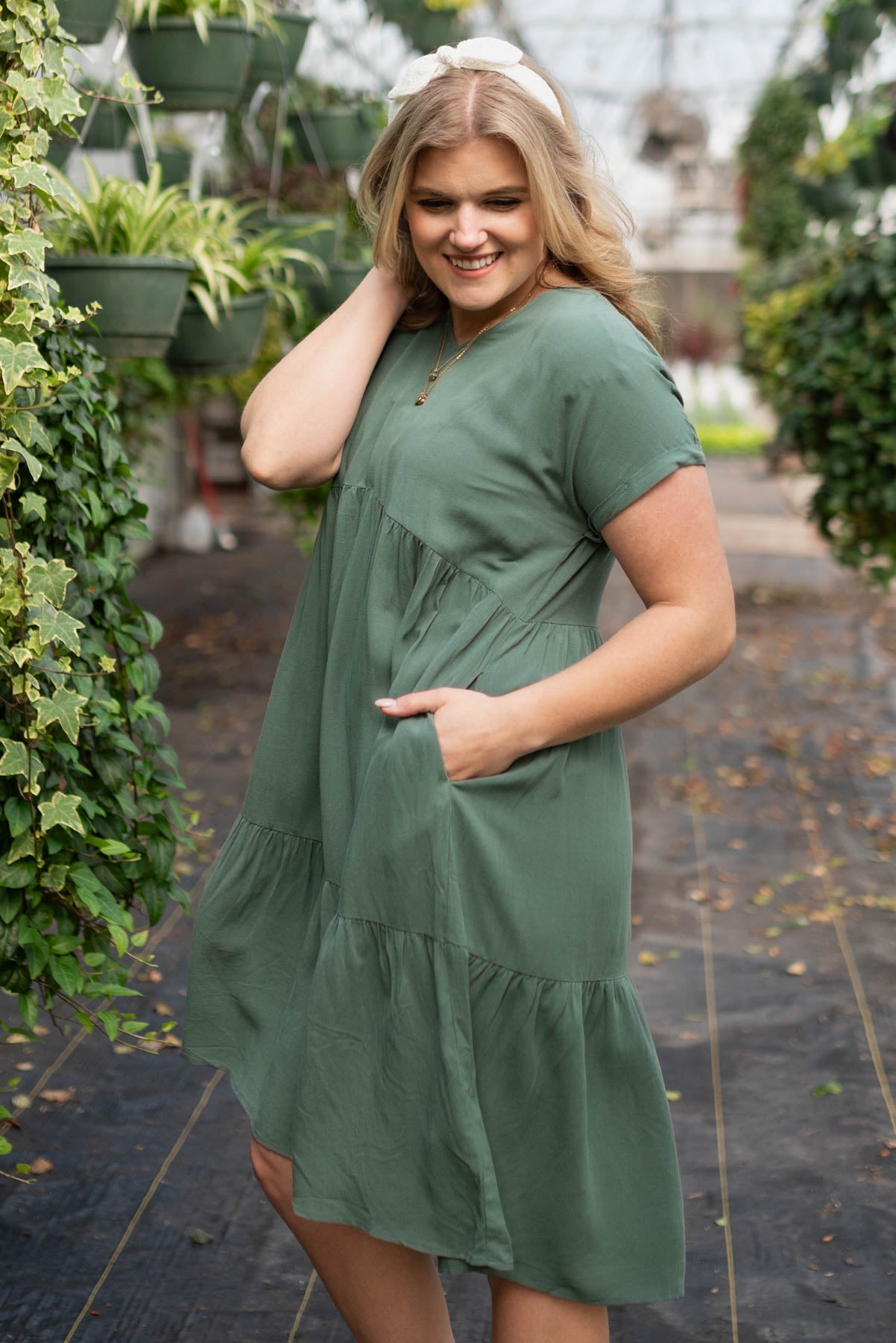 Side view of the jade tiered dress with pockets
