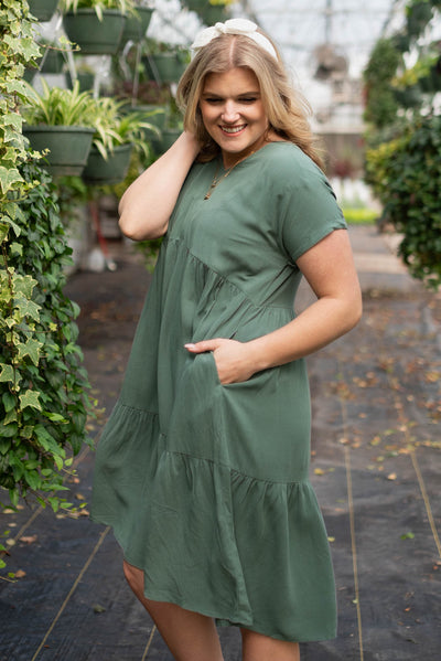 Side view of the jade tiered dress with pockets